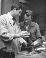 Splint Shop Technicians discuss an orthotic, circa 1970s