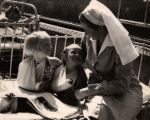 Nurse With Children on Bed, 1945 Nurse With Children on Bed, 1945
