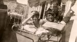 Children on Bed with Adults Nearby, 1944 Children on Bed with Adults Nearby, 1944