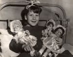 Child with Dolls on Bed, Circa 1937 Child with Dolls on Bed, Circa 1937