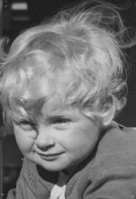 Close up of an infant posing for the camera. Portrait of a Child, Circa 1955
