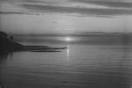 Long scenic shot of a beach at sunset. Landscape View of the Beach, Circa 1955