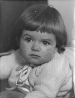 A close up shot of a young child facing the camera. Portrait of a Child, Circa 1955