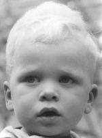 A close up shot of a young child facing the camera. Portrait of a Child, Circa 1955
