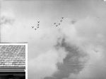 Long shot of a cloudy sky showing two groups of planes flying in formation. Planes in the Sky, Circa 1955