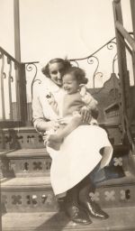Nurse Holding an Infant on the Stairs, Circa 1941 Nurse Holding an Infant on the Stairs, Circa 1941