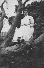Nurse Posing on a Tree Branch, Circa 1915 Nurse Posing on a Tree Branch, Circa 1915