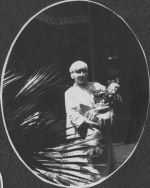Staff Member Holding an Infant, Circa 1915 Staff Member Holding an Infant, Circa 1915