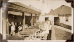 Long shot of staff and patients outside with beds. Exterior of buildings are in the background. Heliotherapy at Frankston, Circa 1941