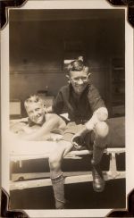 Long shot of two children on a bed. Smiling for the Camera, Circa 1941