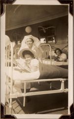 Long shot of a staff member and two patients on beds. Enjoying the Sunshine, Circa 1941
