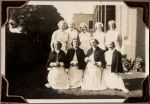 Long shot of nine staff members, formally arranged in the garden. Staff Portrait, Circa 1941
