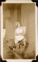 Long shot of a staff member sitting on a chair while holding a book. Nurse in a Deckchair, Circa 1941