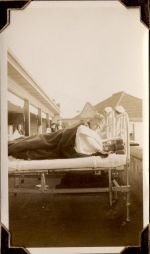 Long shot of exterior view of hospital with patients and staff outdoors. Patient in Bed, Circa 1941