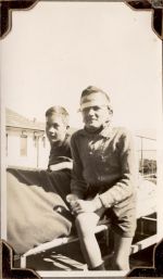 Medium shot of two patients sitting on a bed outside. Two Boys Sitting in Bed, Circa 1941