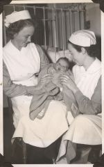 Two nurses with baby, Circa 1943 Two nurses with baby, Circa 1943