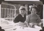 Two children on bed, Circa 1943 Two children on bed, Circa 1943