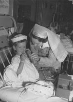 Nurse with patient and Christmas presents, Circa 1943 Nurse with patient and Christmas presents, Circa 1943
