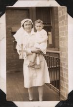 Nurse Holding a Small Child with Flag, Circa 1943 Nurse Holding a Small Child with Flag, Circa 1943