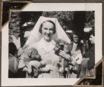 Nurse holding puppies, Circa 1943 Nurse holding puppies, Circa 1943