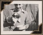 Boy holding puppy, Circa 1943 Boy holding puppy, Circa 1943