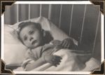 Medium shot of a very young child lying in a cot. Time For Bed, Circa 1945