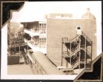 Long shot of multiple story hospital building with walkway, staircases and verandah. Photo is taken from a few stories up. Women's Hospital, Circa 1946