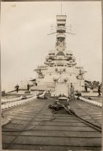 A long shot of a navy ship in dock with sailors. Navy Ship, 1928