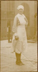 A long shot of a Nurse standing outside. Portrait of a Nurse, 1928