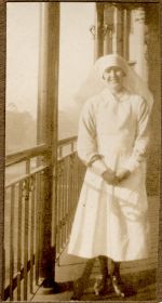 A long shot of a Nurse standing outside on a balcony. Portrait of a Nurse, 1928