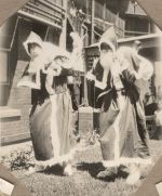 A long shot of two people dressed as Father Christmas. Father Christmas, 1928
