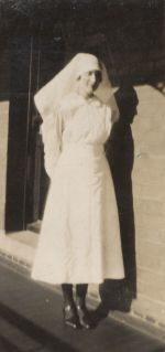 A long shot of a Nurse standing outside. Portrait of a Nurse, 1928