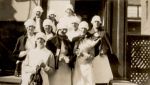 A medium shot of ten Nurses standing outside on steps. Nurses in the Hospital Grounds, 1928