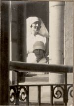 A long shot of two Nurses taken through an open window. Nurses Peering out the Window, 1928
