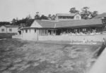 Long shot of hospital ward with a Nurse, patients in cots outside. Exterior View of Buildings, Circa 1940