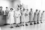 Staff patiently await the arrival of Queen Elizabeth II