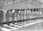 Staff line the entrance way awaiting Queen Elizabeth II